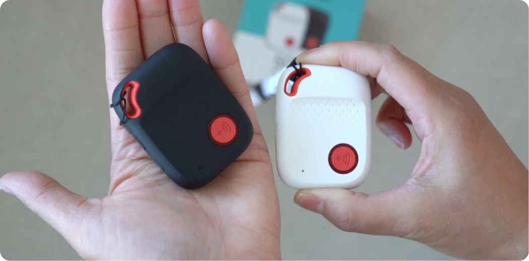 zoomed in on fall detection monitor held proudly by lady