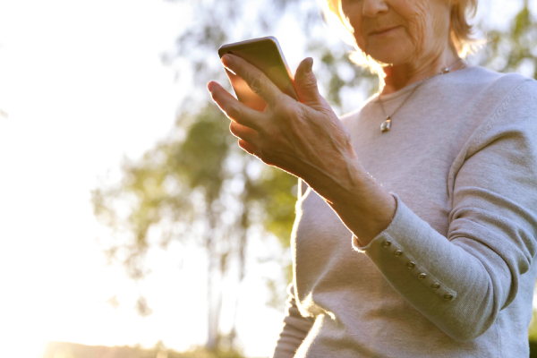 elderly lady holding smart phone