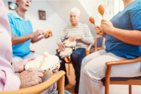 Seniors-in-nursing-home-making-music-with-rhythm-instruments