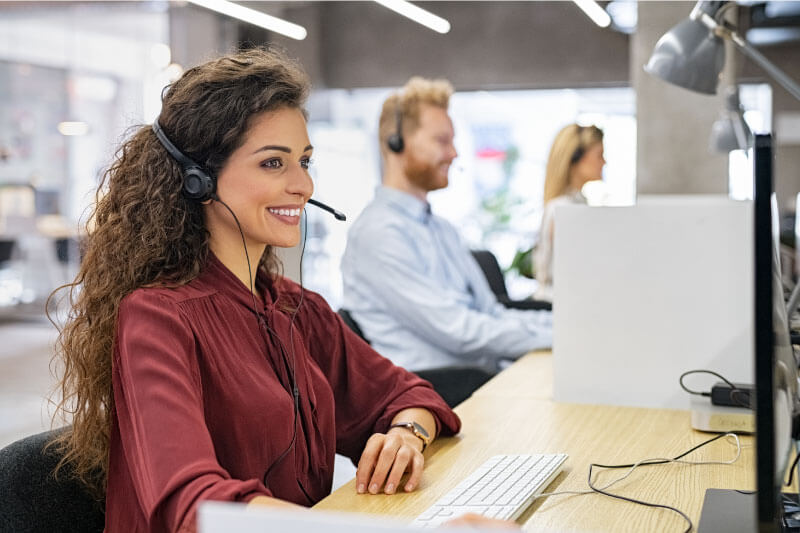 female call center dispatcher smiling