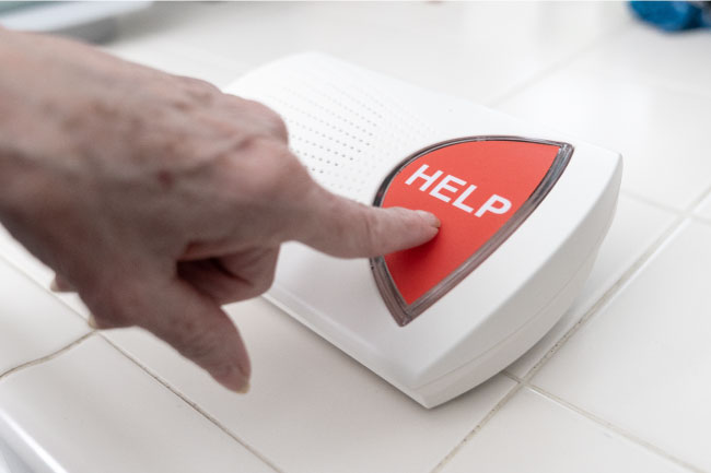 hand pressing bay alarm medical alert in-home help button